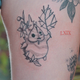 A person with a Korok tattoo poses for a photograph.